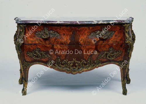 Commodes with gilded bronze decorations