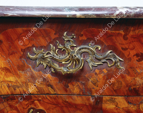 Commode with gilded bronze trim. Detail