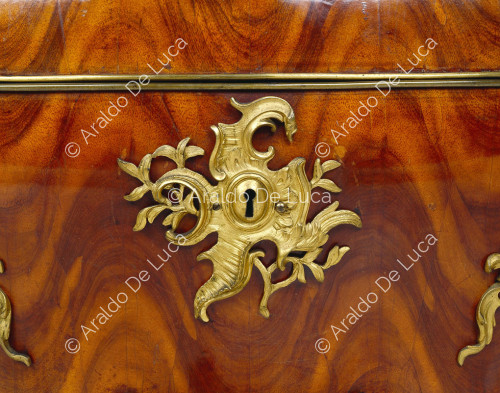 Commode with gilded bronze trim. Detail