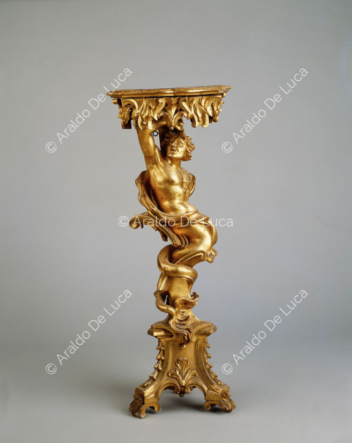 Candlestick with Triton. Gilded guéridones supported by triton