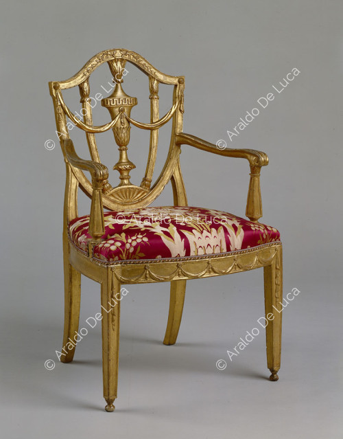 Sculpted, carved and gilded wooden armchair
