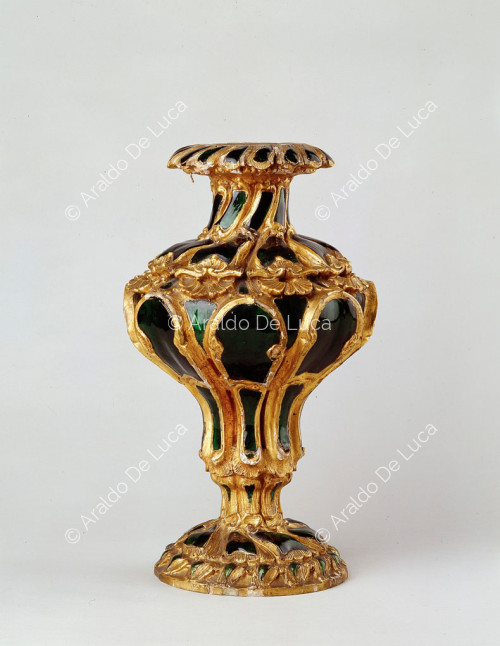 Wooden vase with green glass applications