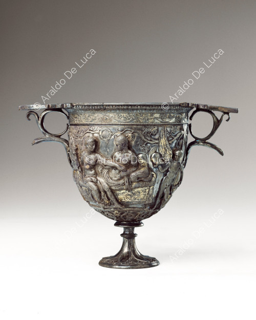 Silver cup embossed with figures