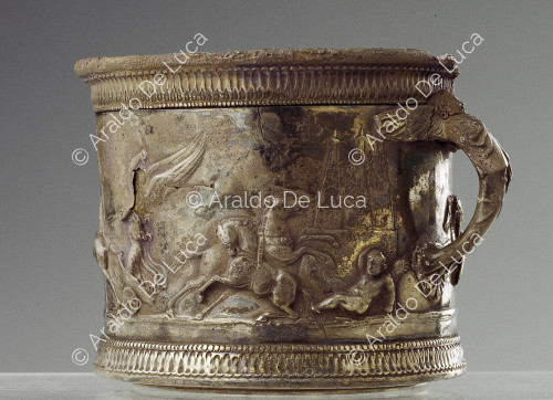 Embossed silver cup with winged charioteer and anthropomorphic handle