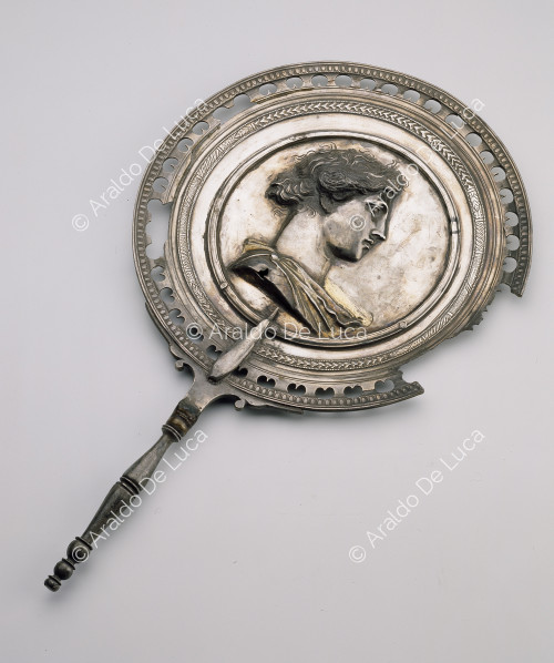 Silver mirror with bust of Apollo