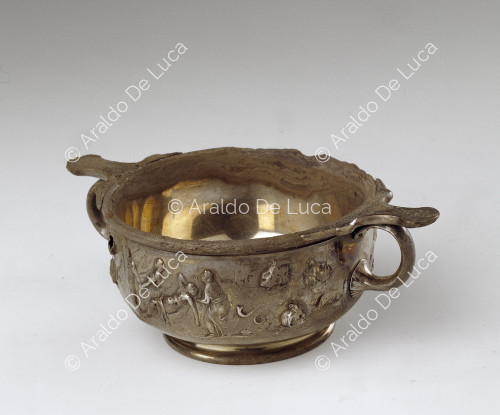 Silver cup with embossed handles
