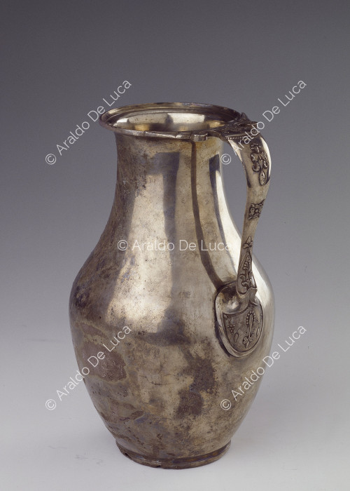 Silver jug with embossed decorated handle