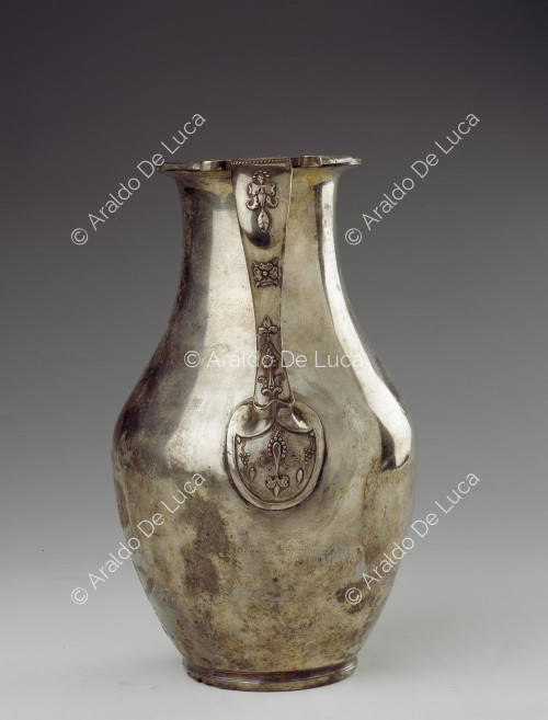 Silver jug with embossed decorated handle