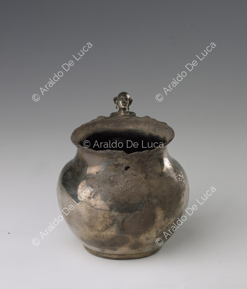Silver jug with decorated handle