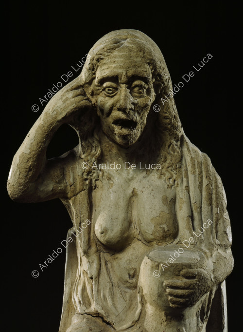 Pictorial statuette of a drunken old woman
