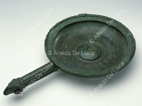 Bronze vessel with decorated handle