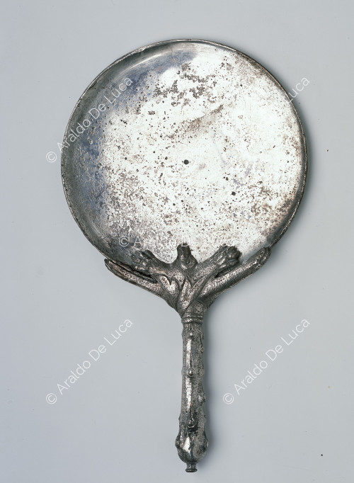 Silver mirror with decorated handle