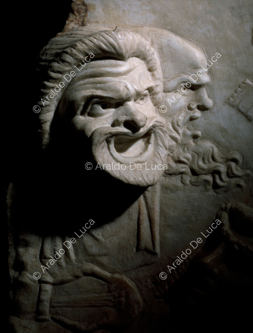 Marble relief with theatre masks. Detail with tragic mask