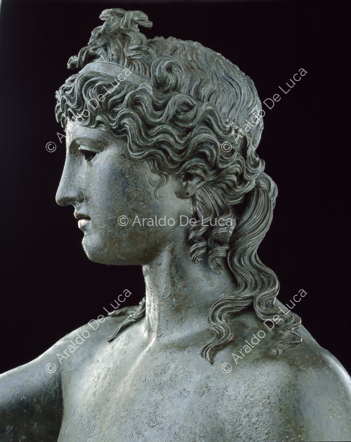 Nude Dionysus in bronze. Detail of the face