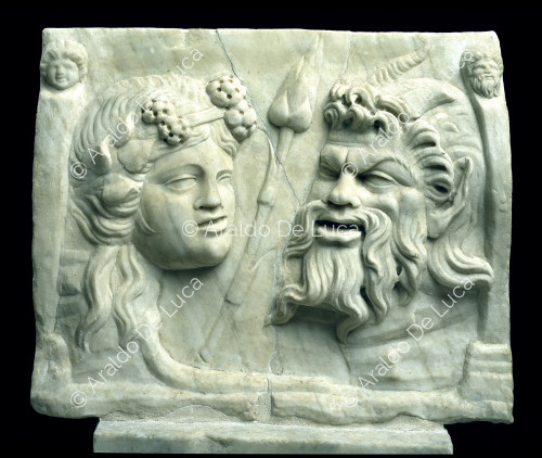 Marble relief with masks