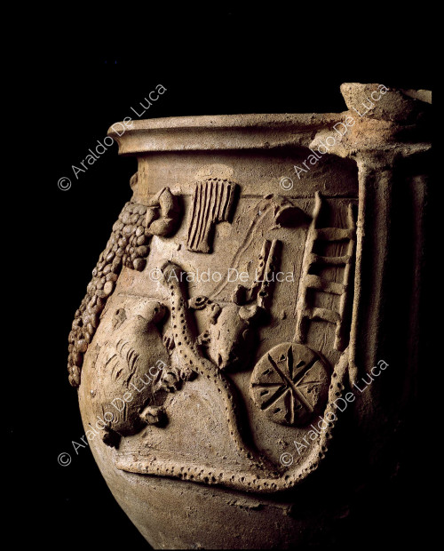 Magic terracotta vase. Detail of the handle