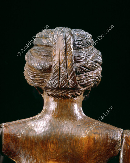 Head of the Crepereia Tryphaena doll.Detail behind