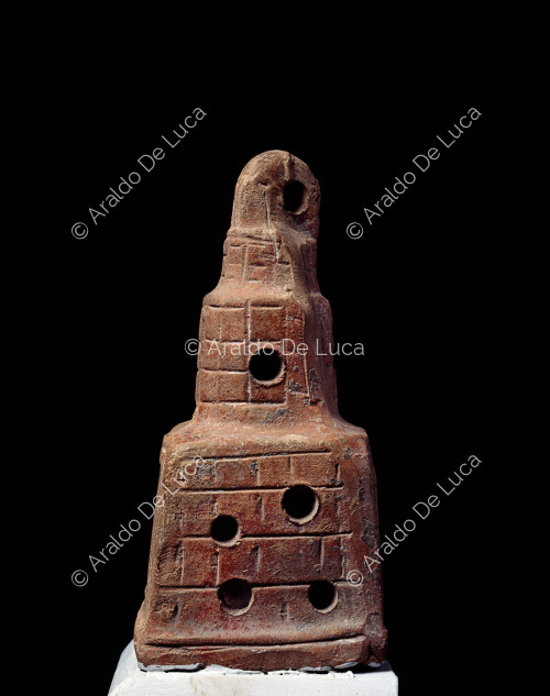 Terracotta lantern in the shape of a lighthouse