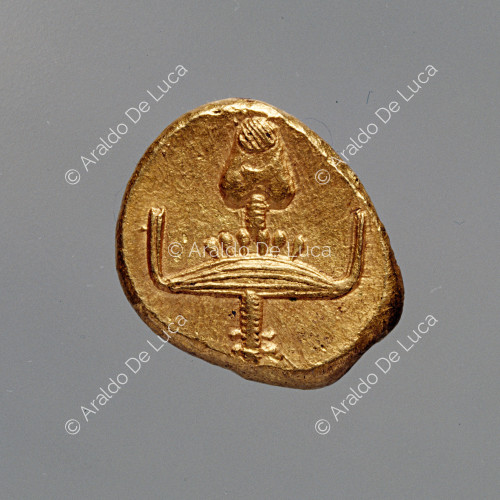 Gold coin with hieroglyphic symbols