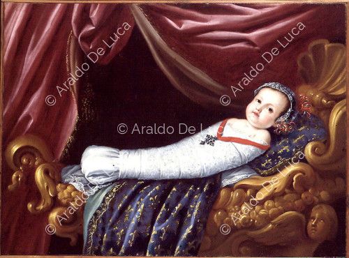Child in swaddling clothes with devotional cross