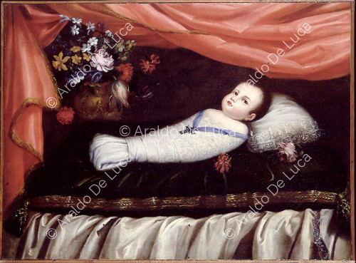 Child in swaddling clothes with devotional cross