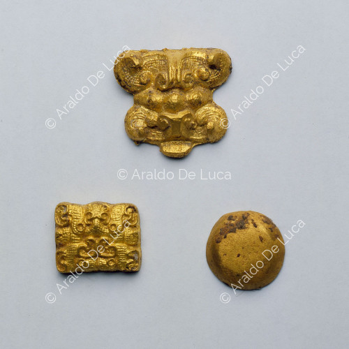 Studs for harnesses including one in the shape of a theriomorphic mask