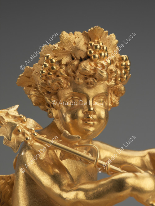 Triumph of Bacco child - Table clock, detail of the face of Bacco