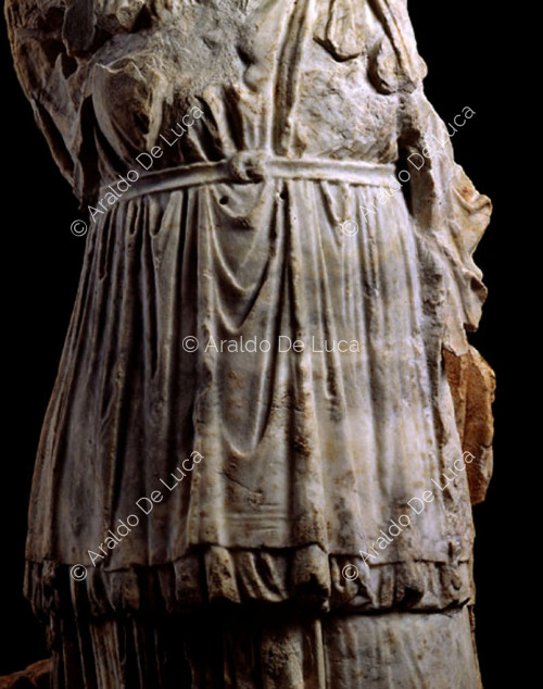 Headless female statue. Detail